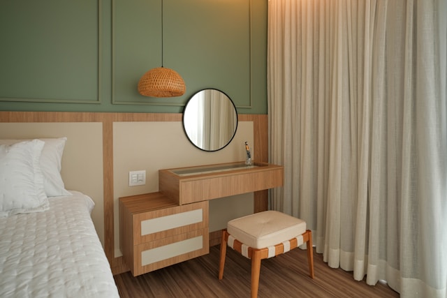 A stylish vanity table is-featured in the bedroom
