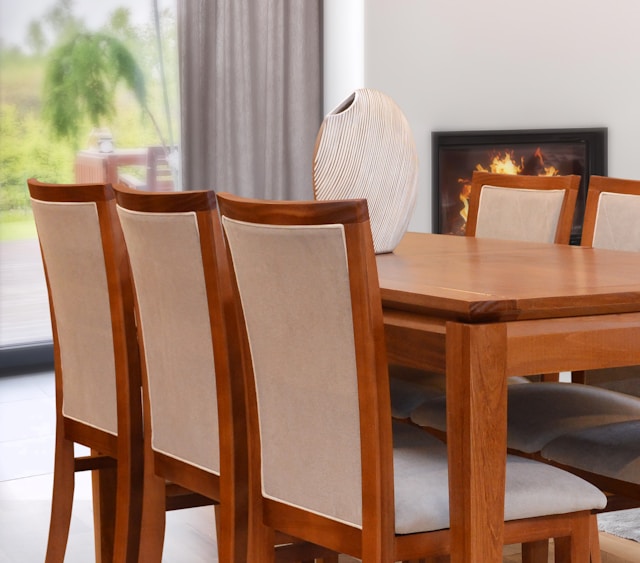 Dining room with wooden table and upholstered chairs