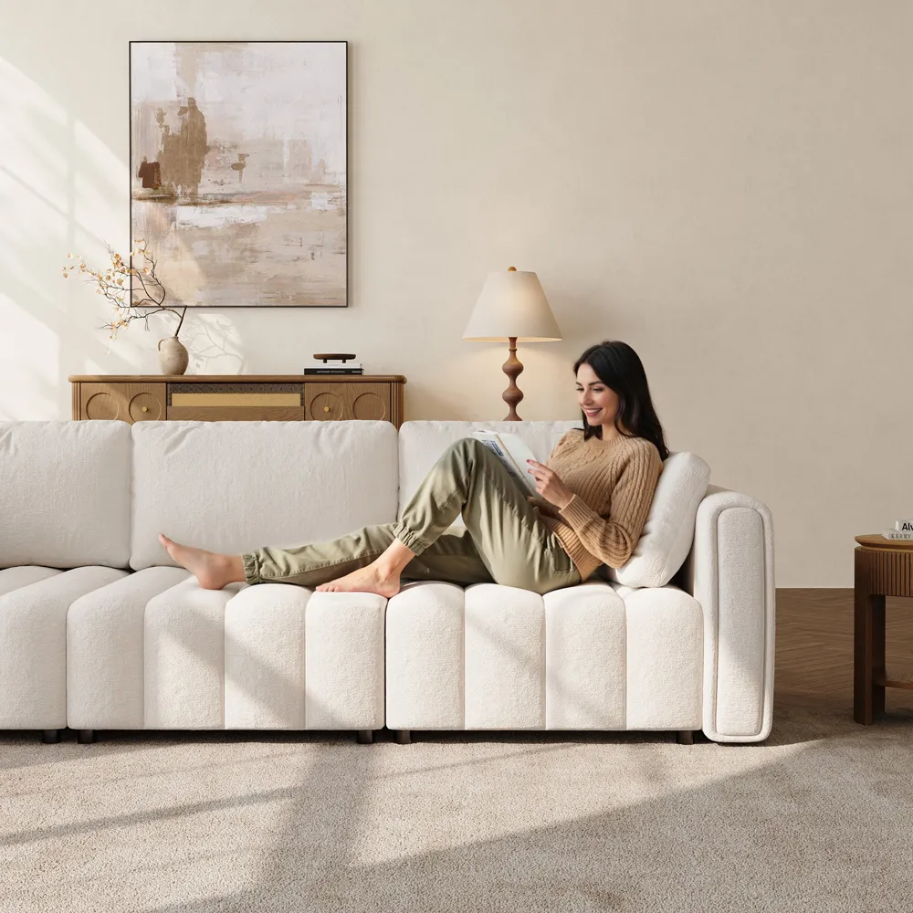 a woman sitting on Retro Hand-Tufted Beige Chenille Sofa