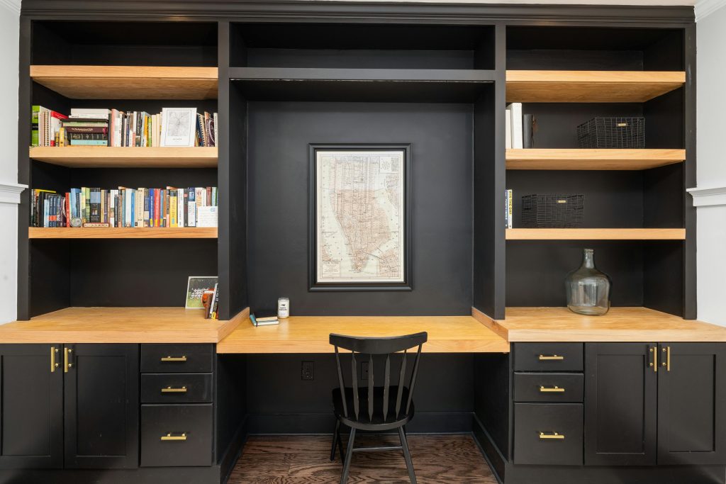 Sleek black-and-wood office setup with shelves