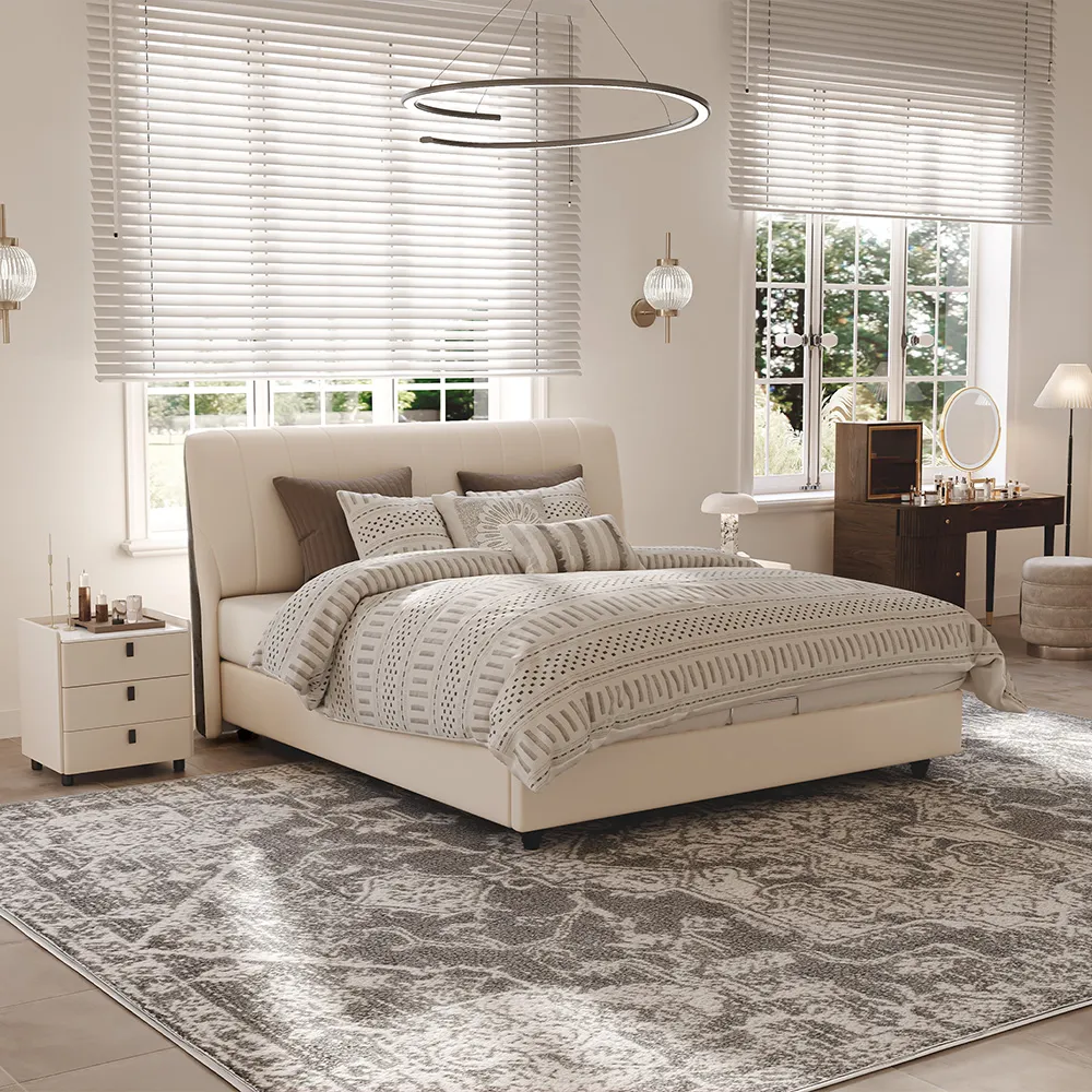 a white nightstand next to bed