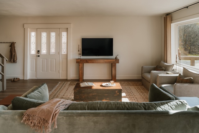 cozy living room with loveseat sofas television and warm lighting for winter lounging