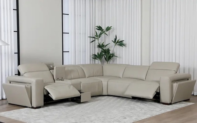 A beige sectional sofa is in a modern living room.