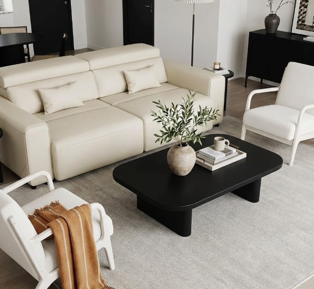 Sleek white best sleeper sofa with easy pull-out bed mechanism, gold floor lamp, ribbed marble side table, and fresh tulips in minimalist room