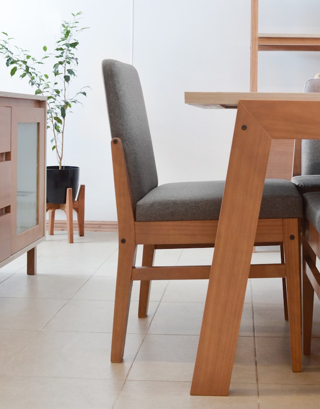 Bright dining room with a modern wooden dining table and matching chairs, illustrating timeless sustainable wood furniture