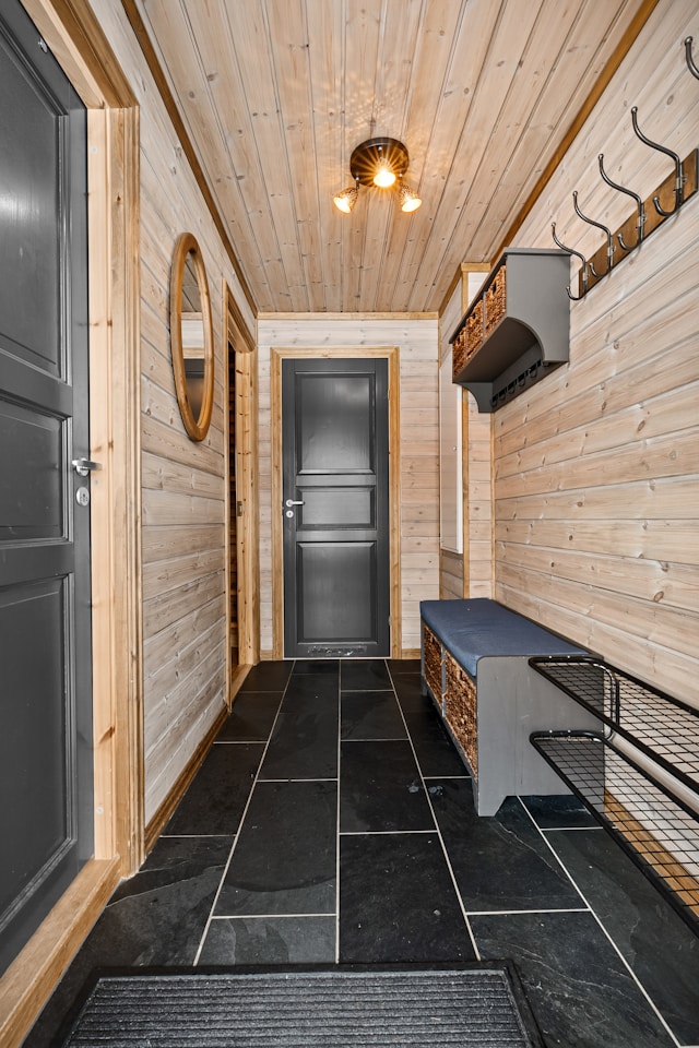 Bright hallway with entryway bench, wall mirror and soft lighting