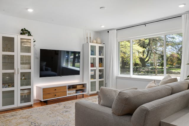 Bright living room with sofa and TV console