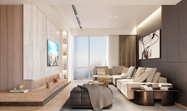 Bright modern living room with a large sectional and city views, ideal for
