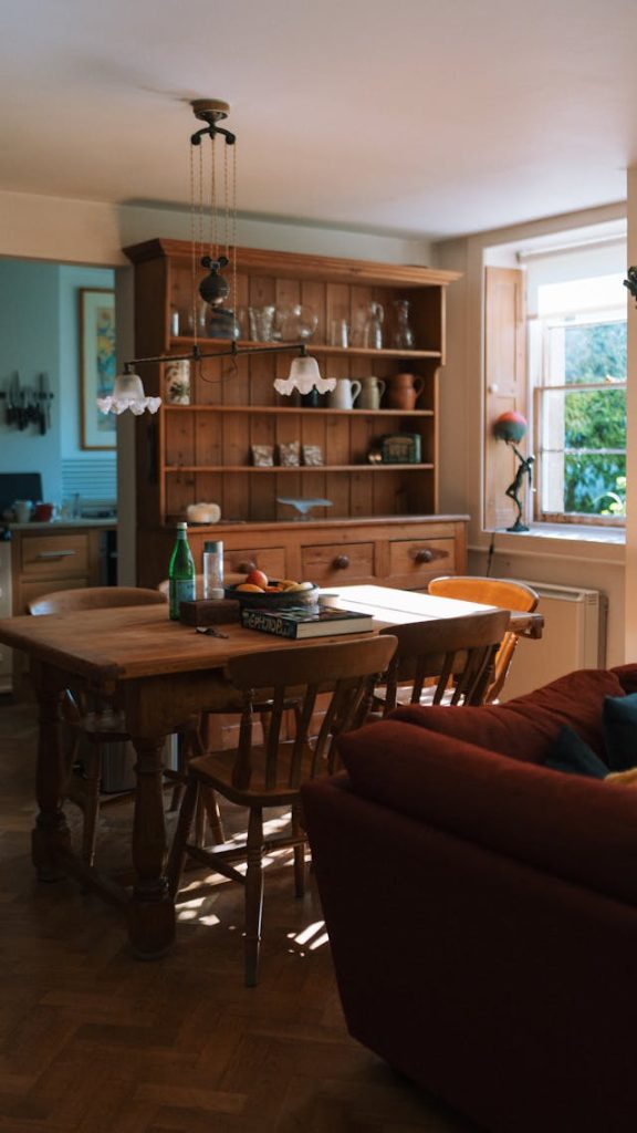 Cozy sunlit dining room with a wooden table and chairs, highlighting timeless sustainable wood furniture