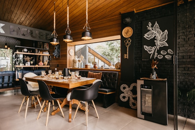 Mid century inspired dining room with wooden table, upholstered chairs and wood paneling
