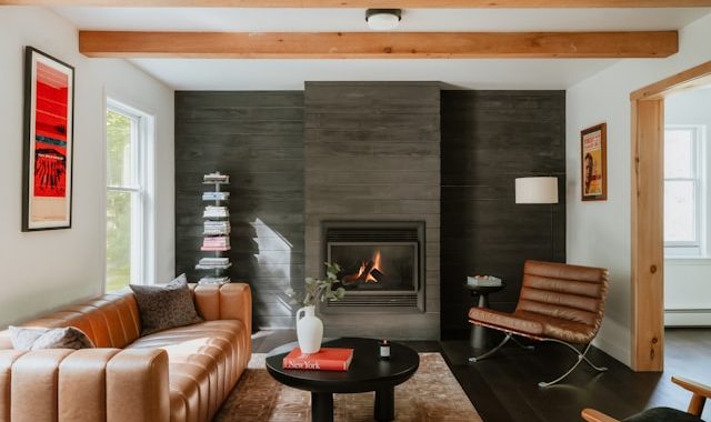 Modern living room with leather sofa and fireplace