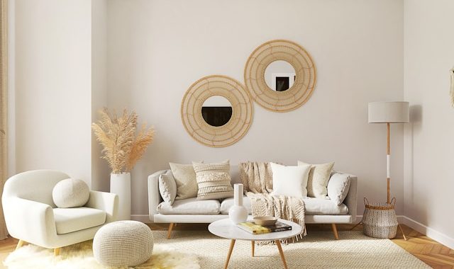 a small living room filled with furniture and a mirror