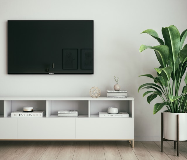 a white tv stand in the living room
