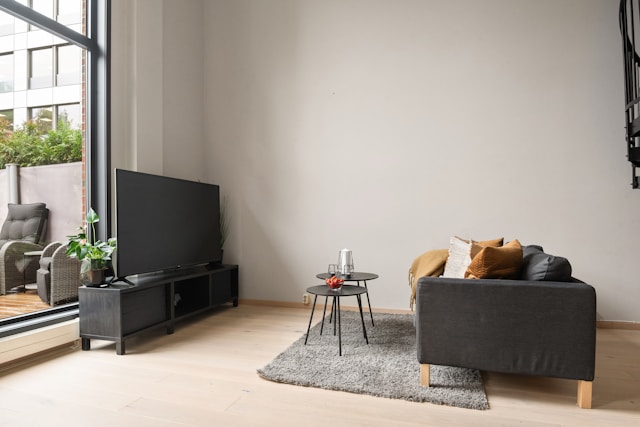 black wooden tv stand in a living room