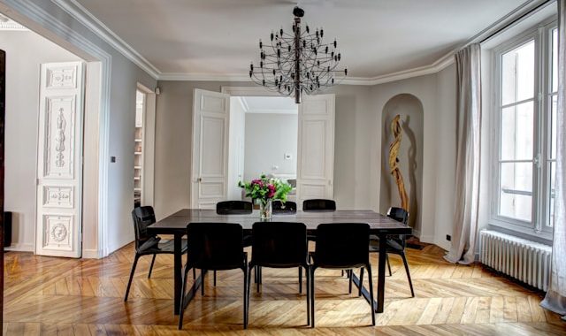 brown wooden dining set inside room