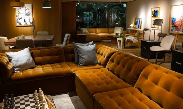 cozy indoor living room with green velvet sofa and contemporary decor