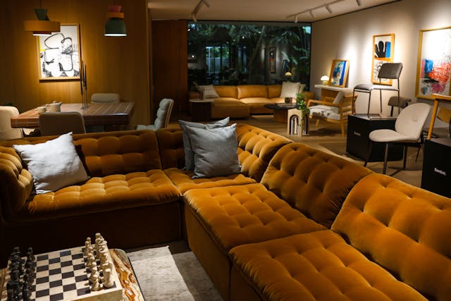 cozy indoor living room with green velvet sofa and contemporary decor