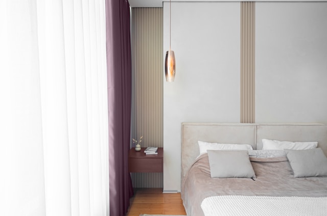 low profile bed- bedroom interior with bed and curtains