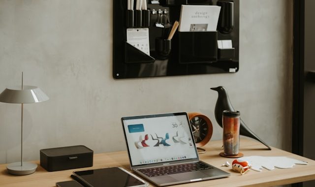 modern home office with lamp and leather office chair and minimalist desk