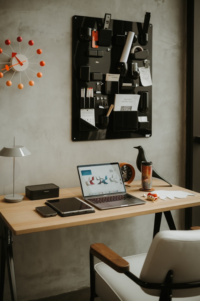 modern home office with lamp and leather office chair and minimalist desk