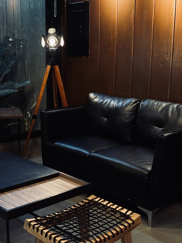 A cozy living room with a leather couch