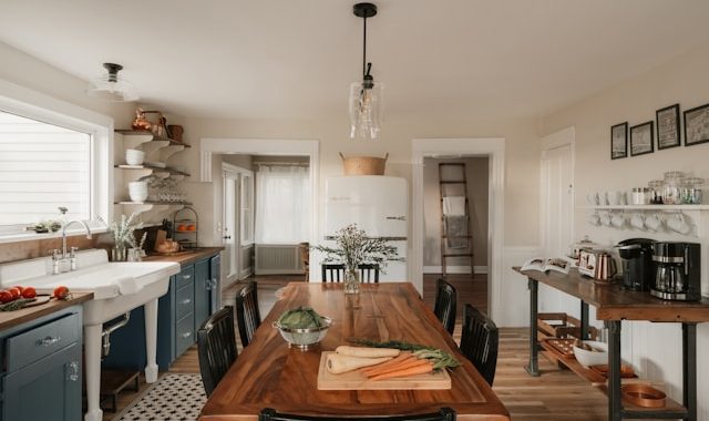 Bright farmhouse kitchen with dining table and island