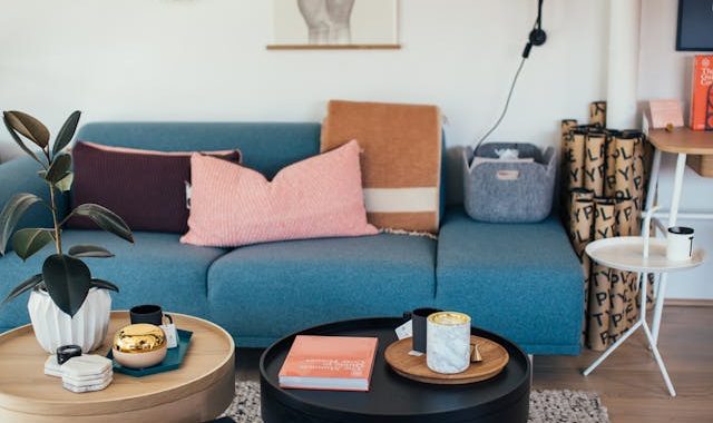 Interior of living room with cozy couch and round coffee tables