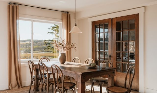Rustic dining room with a long wooden table and chairs