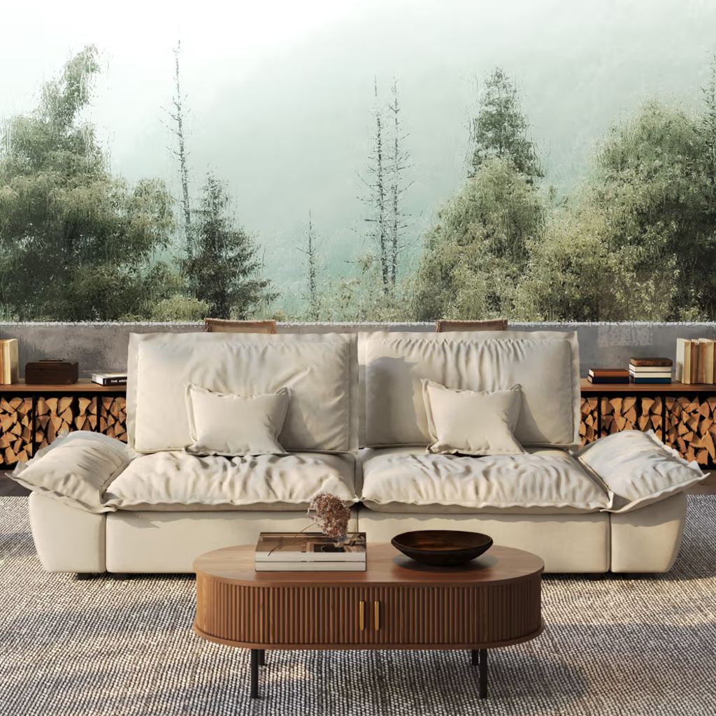 Cream adjustable-back sofa with deep cushions and wide pillow arms in a warm living room with a wood coffee table.