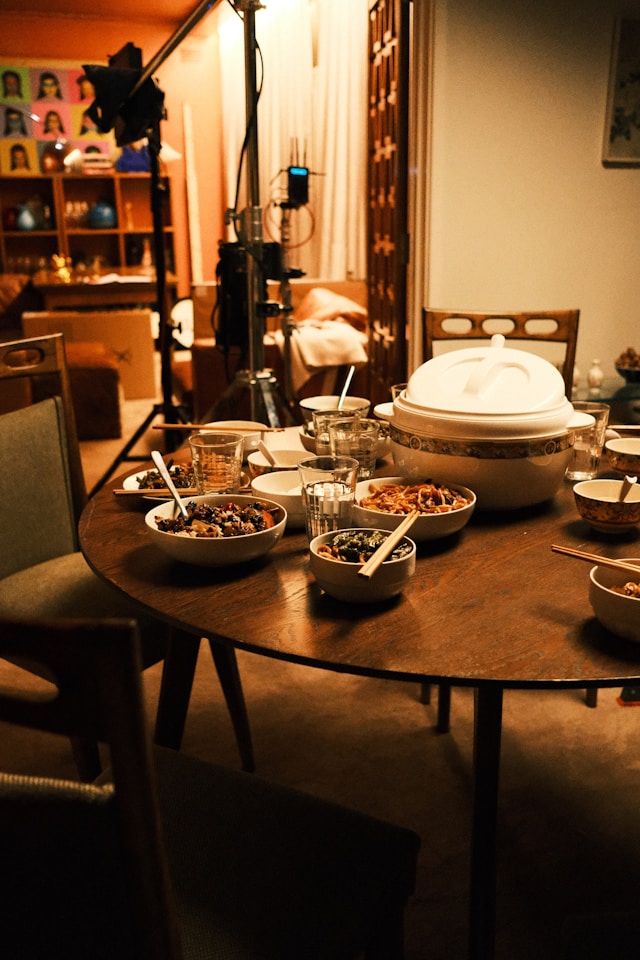 round dining table with bowls of food on it