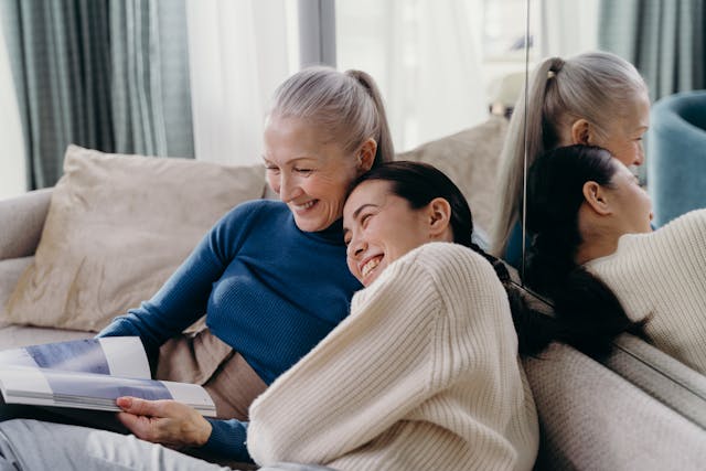 two people sitting on sofa