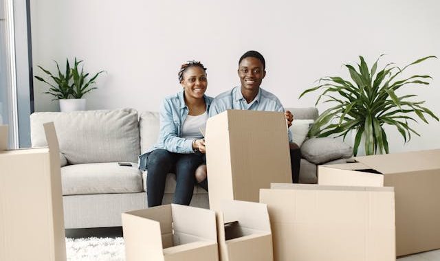 A Young Couple Set Up a Recliner Sofa
