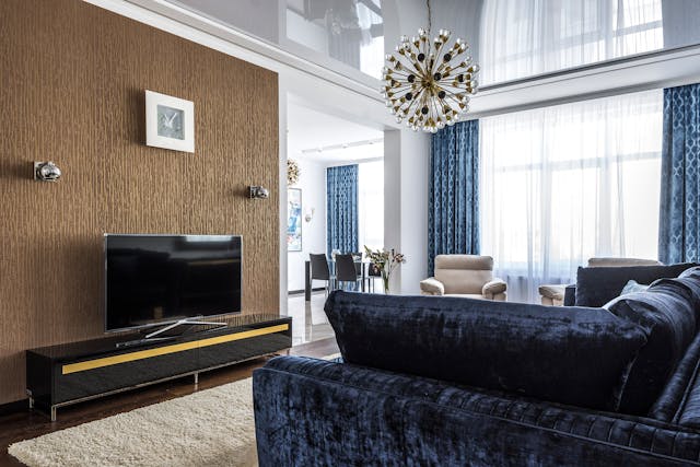 a blue reclining sofa in the living room