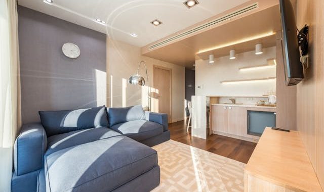 a blue sofa bed in the living room