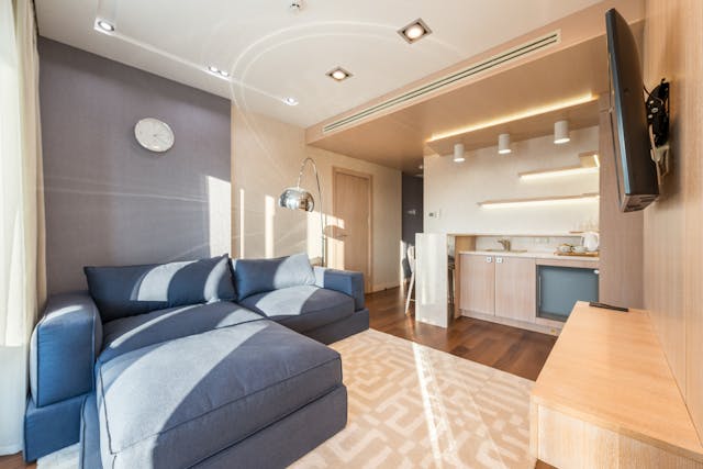 a blue sofa bed in the living room