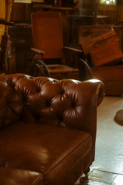 a brown leather chair sitting in a room