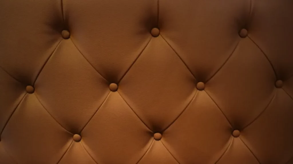 a close up of a leather upholstered wall