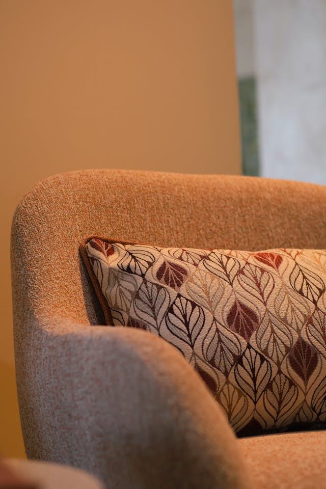 a close up to a sofa that is reupholstered