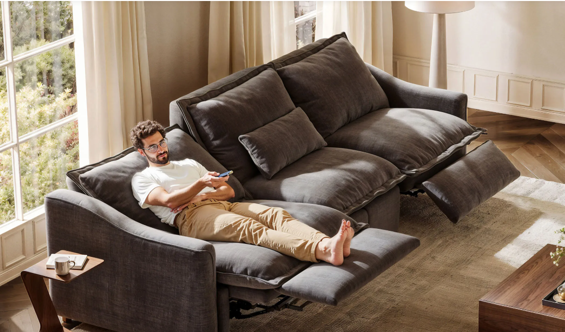 a man lying on a zero gravity recliner