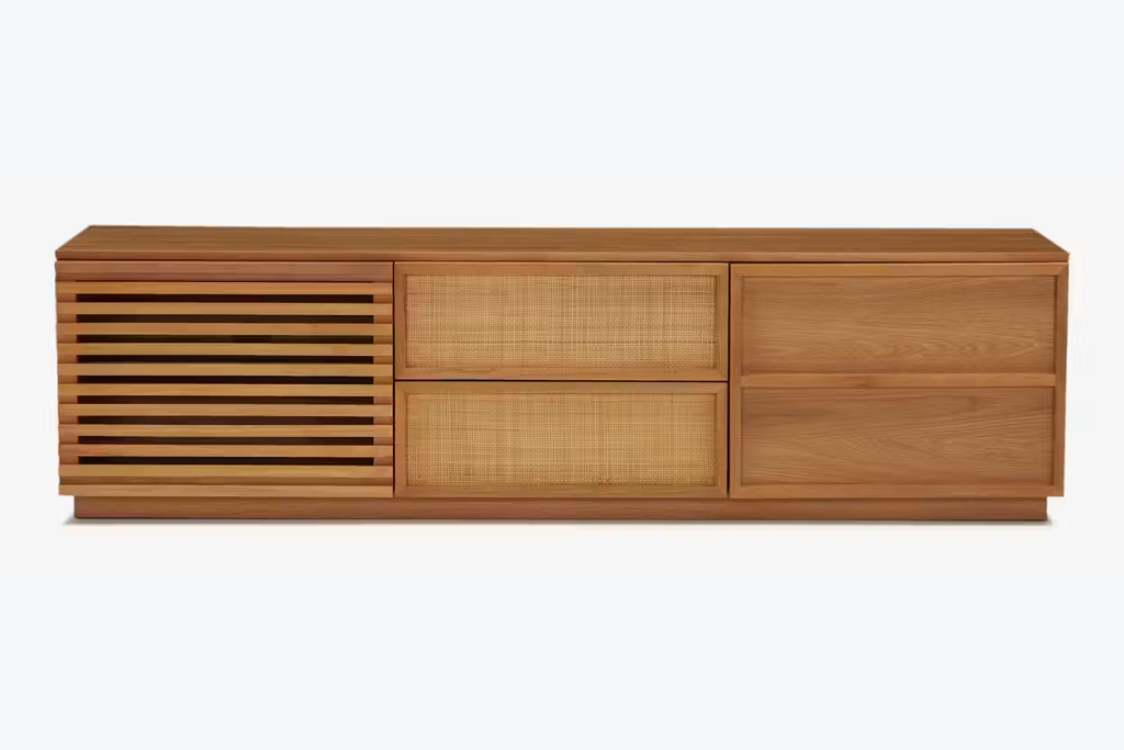 Warm wood 70-inch media console with slatted doors, woven cane panels, and enclosed storage.
