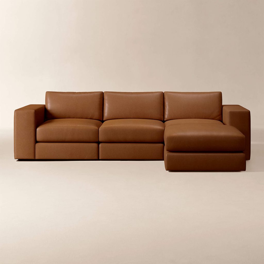 Brown leather modular sofa with chaise in a clean-lined sectional layout