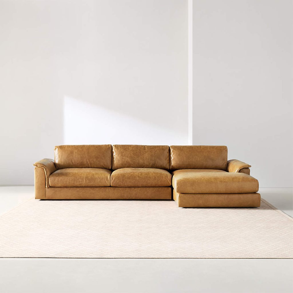 Camel leather sectional sofa with chaise in a modern low-profile living room layout