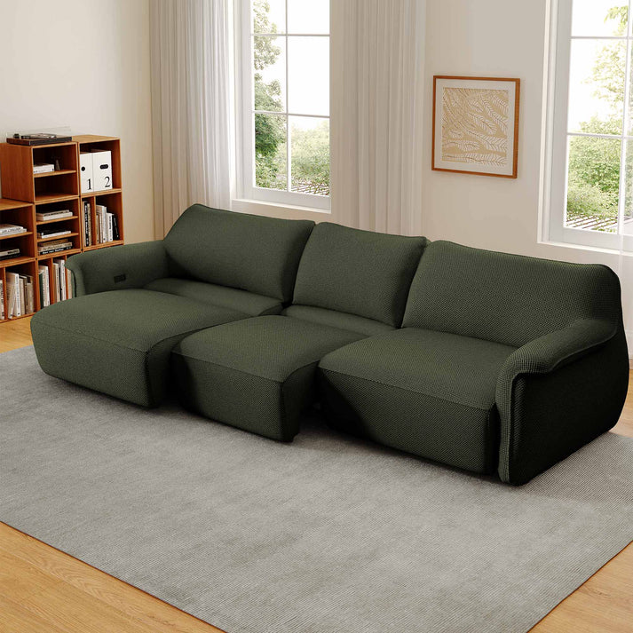 a green power sofa bed with 3 seaters in a modern and bright living room