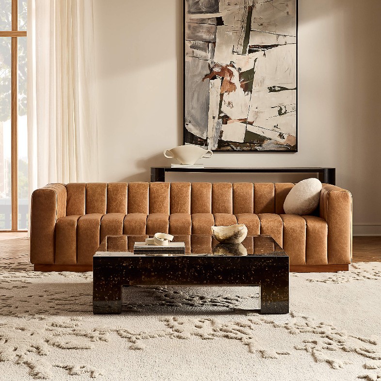 CB2 Forte Channeled Saddle brown Leather Sofa near a low coffee table in a modern living room