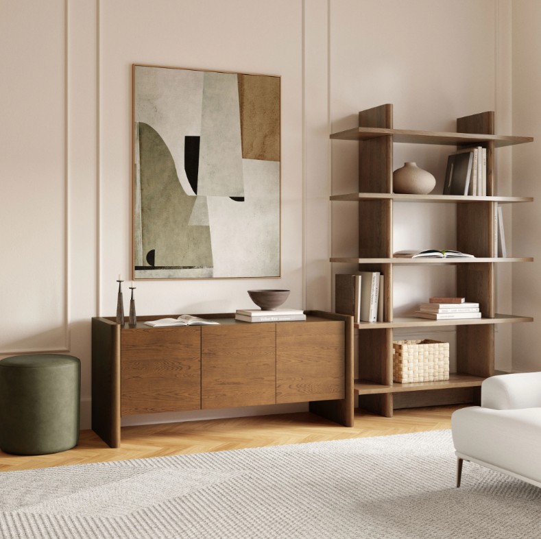 a small tv stand with books and decorations on top near a shelf in a small living room