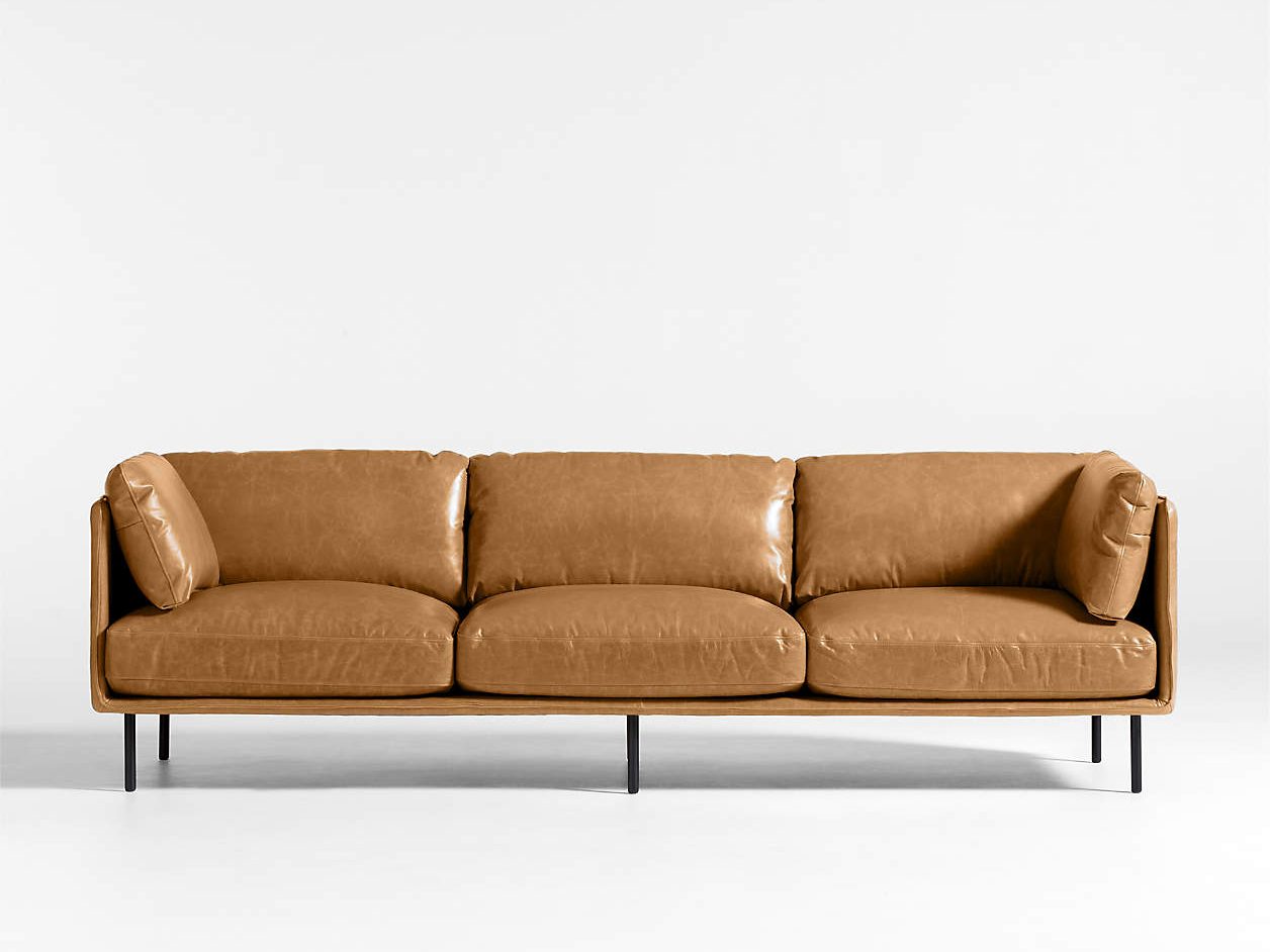a brown leather sofa capable for a cozy living room