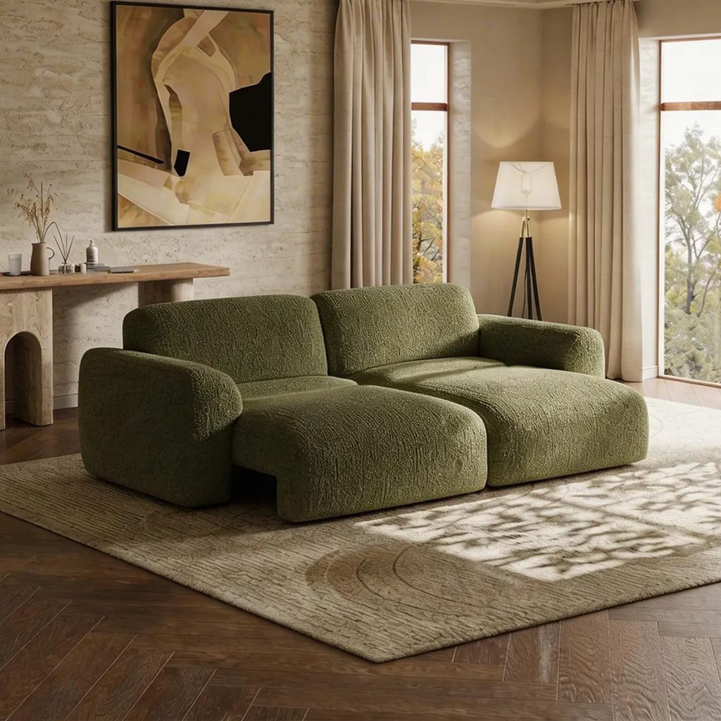Green bouclé two-seat power sofa bed with extended seats in a warm neutral living room.