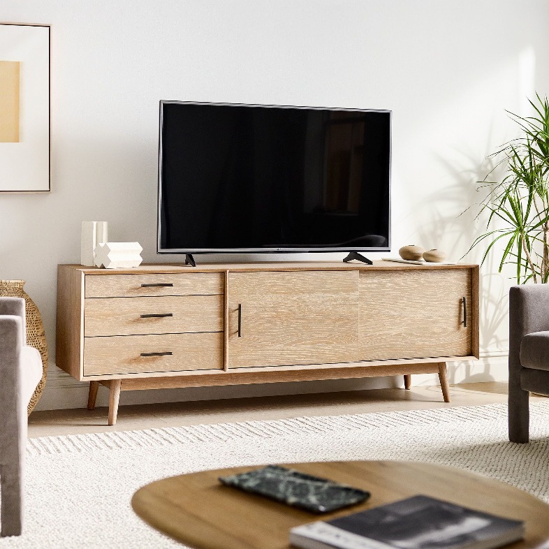 West Elm Mid-Century Media Console with drawers for storage in a bright living room