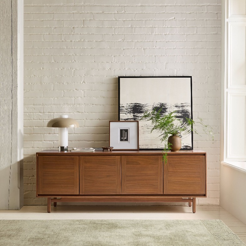 Parquet Media Console with storage and decorations on top