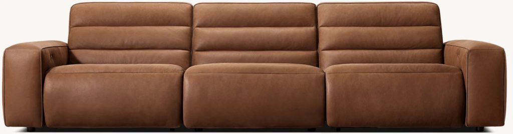 a brown leather reclining sofa